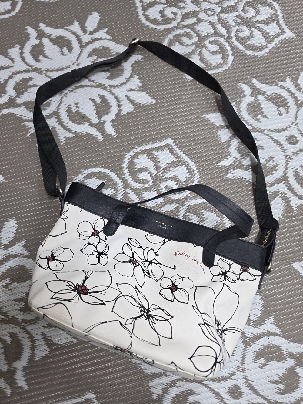 RADLEY LONDON White Floral Crossbody with Black Trim and Red Accents